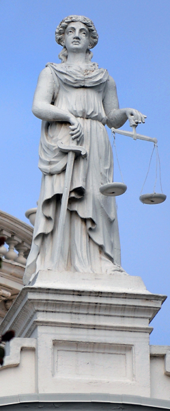 Statue of Roman Goddess Justica or Lady Justice atop the old Merced County Courthouse in Merced California. Photo by Charles Guest of memorable Places Photography